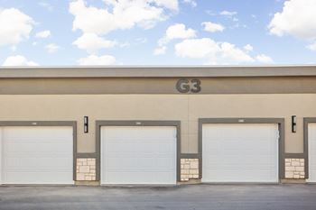 A building with the letters G3 on it and four garage doors.